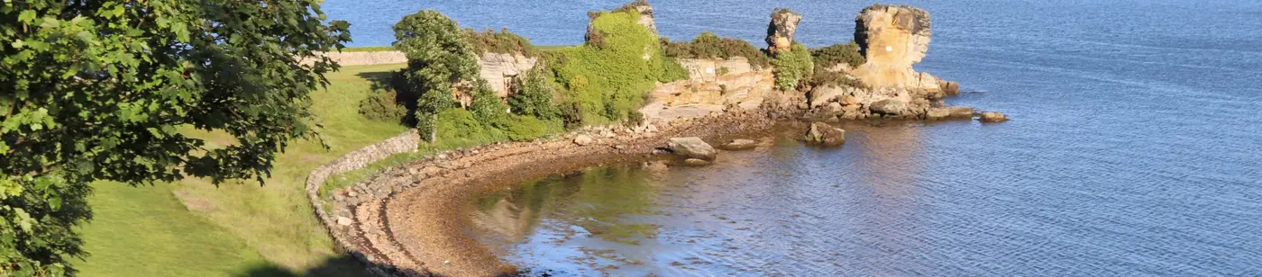 Cliff overlooking waters by golf course